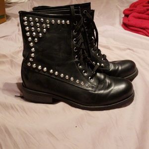 Black combat boots with spikes